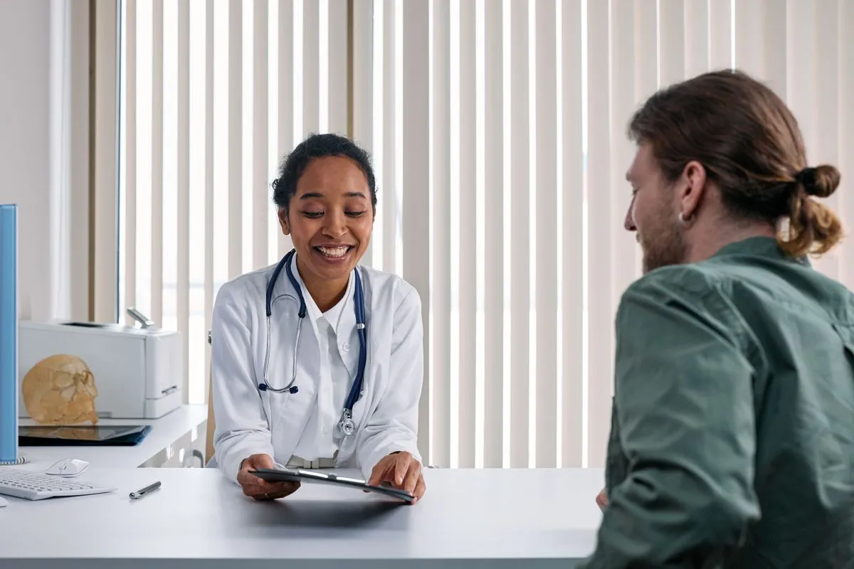 A patient speaking with a healthcare professional